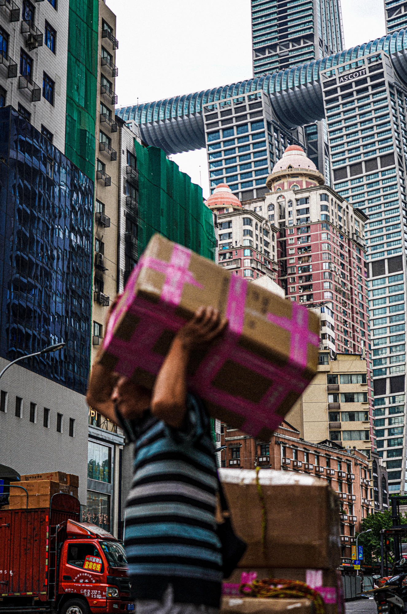 The Weight He Carried — street photograph by Harley Zhong